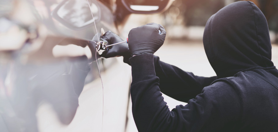 Close up car thief hand holding screwdriver