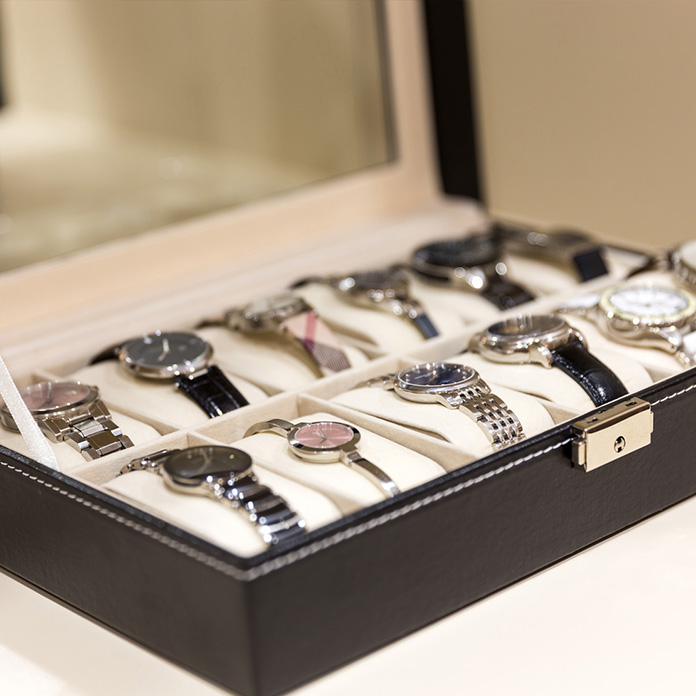 Collection of watches in a watch box