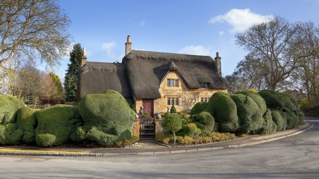 The exterior of a cottage with home insurance