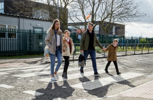 a family crossing the street with relevant life insurance cover