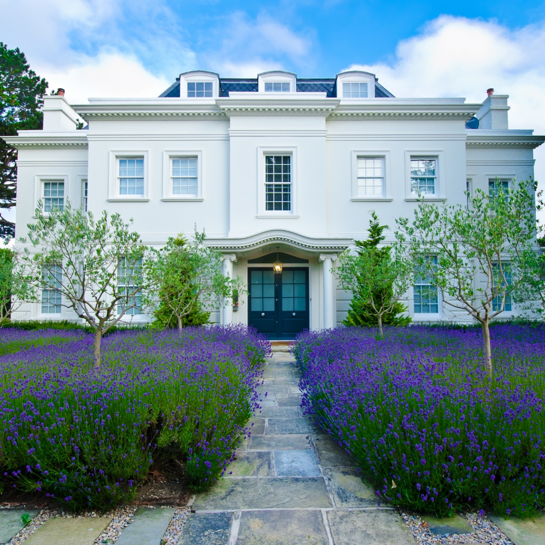 Elevate-high-value-homes-service-house-surrounded-by-flowers