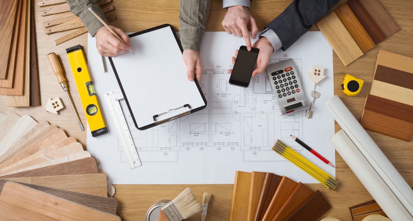 Elevate-high-value-homes-wood-samples-build People working on a high-value home