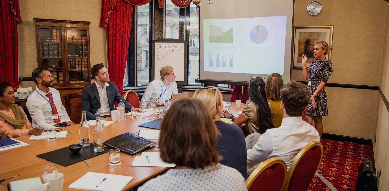 Elevate-relevant-life-insurance-team-presentation Employees in a conference meeting